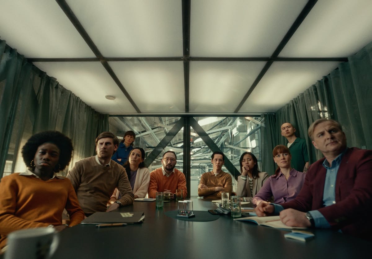 A room of creative professionals watching a screening together.